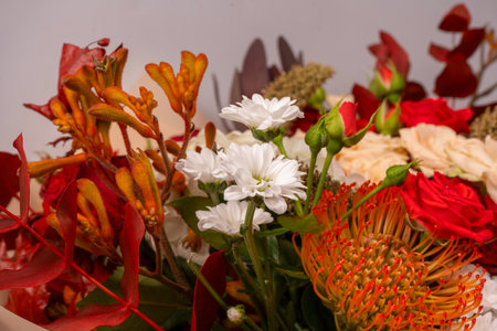 Autumn bouquet of red and white roses, hydrangeas, chrysanthemums as a background. Top view.の写真素材
