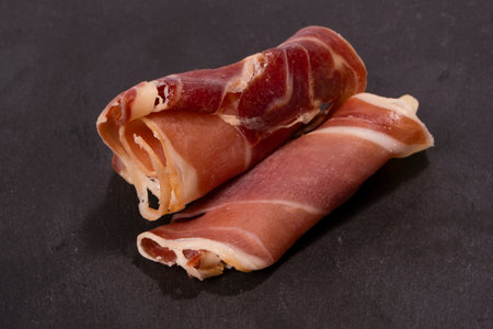 A plate with snacks for wine. Cheese, olives, salami, jamon isolated on a white backgrund.の写真素材