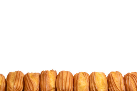 Sweet eclairs isolated on a white background. Top view.