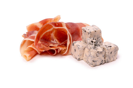 A plate with snacks for wine. Cheese, olives, salami, jamon isolated on a white backgrund.の写真素材