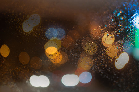 Blurred background with raindrops and lights.の写真素材