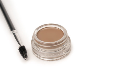 A brow pomade in blonde shade with brush isolated on a white background. make up.の写真素材