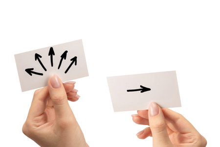 Arrow sign on a card in a woman hand isolated on a white background.