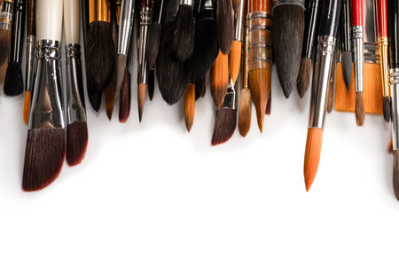 Mix of paint brushes in a row isolated on a white background. Top view.の写真素材