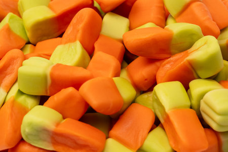 Juicy colorful jelly sweets isolated on white. Gummy candies. Jelly carrots.