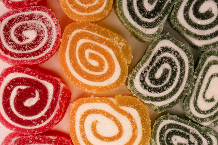 Jelly sweet candy roll isolated on a white background. Marmalade candy.の写真素材