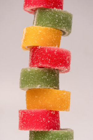 Jelly sweet candy roll isolated on a white background. Marmalade candy.