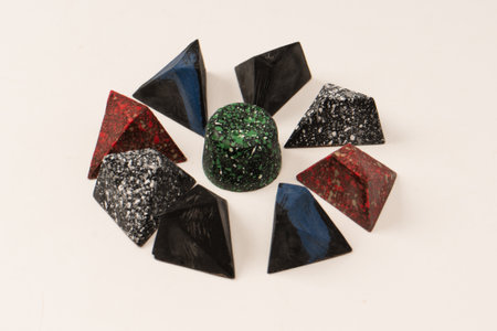 Chocolate candies in the form of precious stones, with marble texture, isolated on a white...