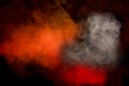 Orange and red steam on a black background. copyspace.の写真素材