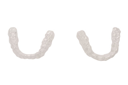 Transparent mouth guard isolated on a white background.