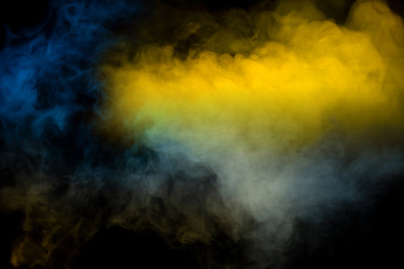 Blue and yellow steam on a black background. copyspace.の写真素材