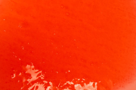 Red slime isolated on a white background. Top view.