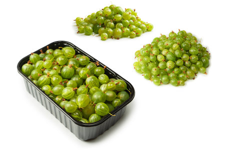 A group of fresh gooseberries isolated on a white background.の写真素材