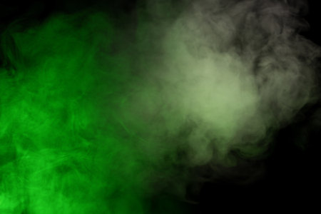 Green steam on a black background. Copy space.の写真素材