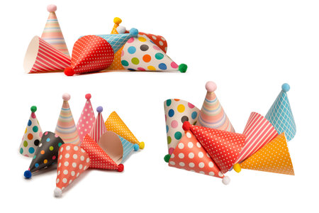 A group of bright and colorful birthday caps isolated on a white background. Holiday concept.の写真素材