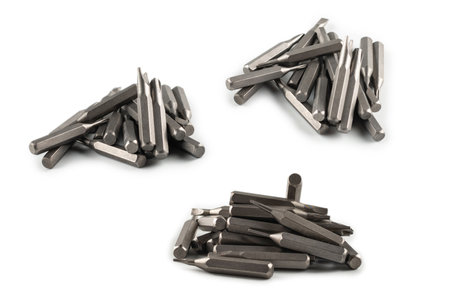 Isolated on a white background tips of a group of phillips head screwdriver bits. Top view.