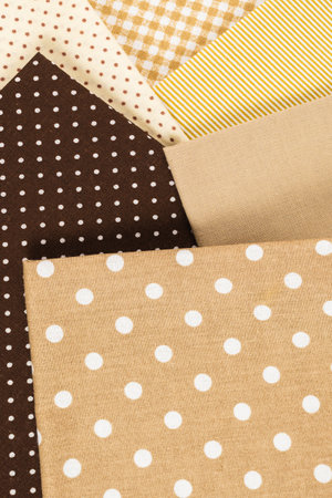 Mix of beige, white and brown cotton fabric. Top view.の写真素材