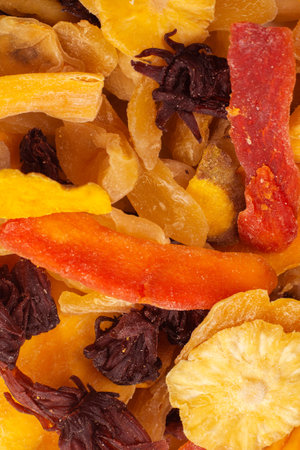 Mix of dried exotic fruit, mangos, slices of pineapples, passion fruit, papaya. Vegetarian dessert.の写真素材