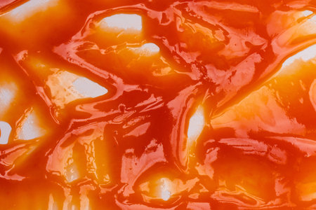 Tasty red sauce splashes as a background.の写真素材