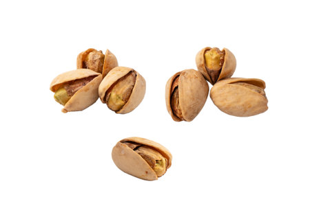 Tasty pistachios isolated on a white background.