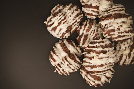 Profiteroles with coconut cream on a black background.の写真素材