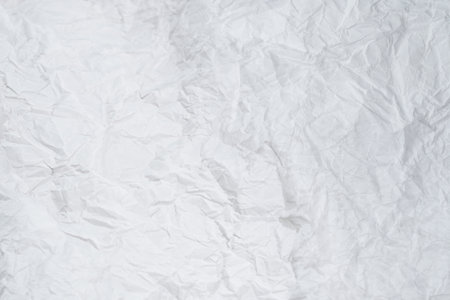 Crumpled white paper background. Top view. Copy space.の写真素材