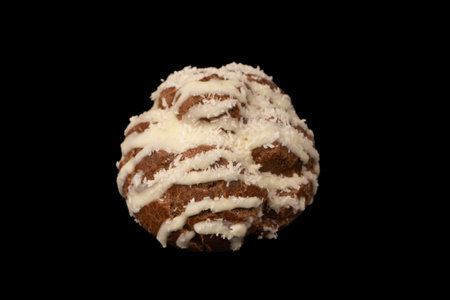 Profiteroles with coconut cream on a black background.の写真素材