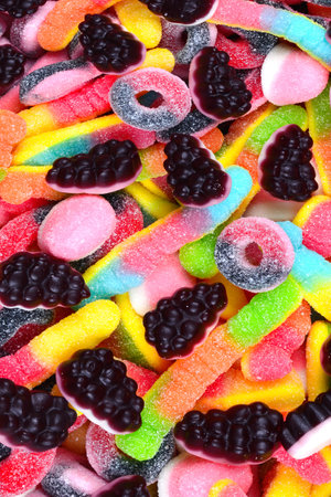 Assorted juicy colorful gummy candies. Top view. Candy background.の写真素材
