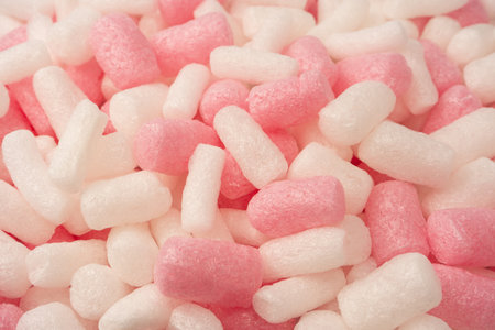 Pink and white box filler as a background. Top view.の写真素材
