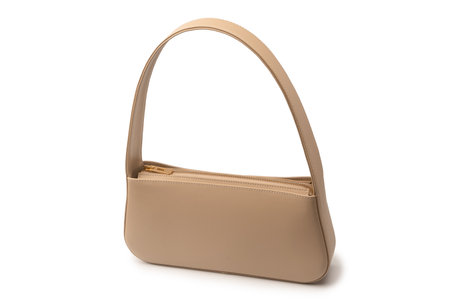 Beige women leather bag isolated on a white background.の写真素材