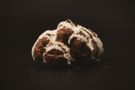 Profiteroles with coconut cream on a black background.の写真素材