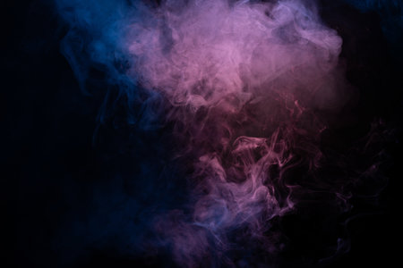 Blue and pink steam on a black background. Copy space.の写真素材