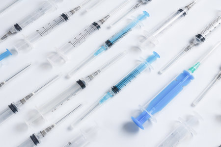 Many medical syringes as a background. Medical equipment.の写真素材