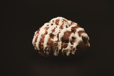 Profiteroles with coconut cream on a black background.の写真素材