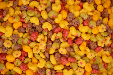 Sweet crunchy cornflakes as background. Top view.
