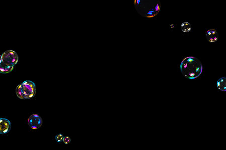 Soap bubbles isolated on a black background. Copy space.の写真素材