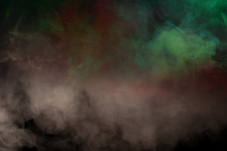 Green and pink steam on a black background. Copy space.の写真素材