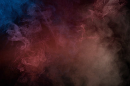 Blue and pink steam on a black background. Copy space.の写真素材