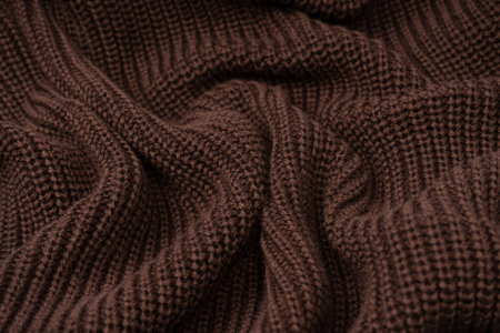 Brown sweater texture as a background. Top view.の写真素材