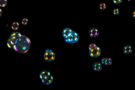 Soap bubbles isolated on a black background. Copy space.の写真素材