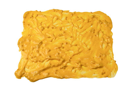 Yellow sauce splashes as a background. Top view.の写真素材