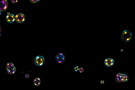 Soap bubbles isolated on a black background. Copy space.