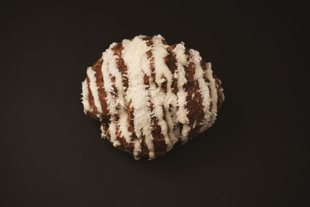 Profiteroles with coconut cream on a black background.の写真素材