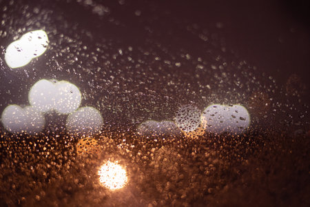 Blurred background with raindrops and lights.