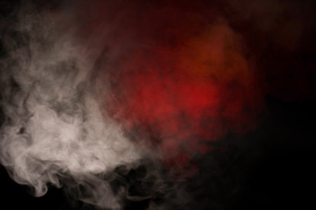 Orange and red steam on a black background. copyspace.の写真素材