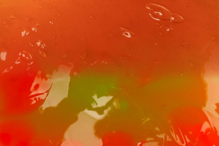 Red slime toy isolated background. Top view.の写真素材