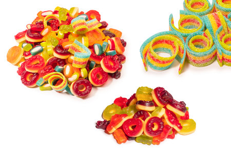 Assorted colorful gummy candies. Top view. Jelly donuts. Jelly bears. Isolated on a white...