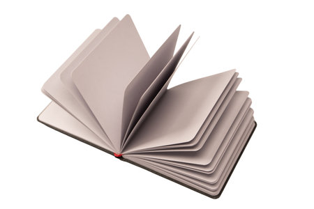 Open notebook with blank pages isolated on a white background. Top view.の写真素材