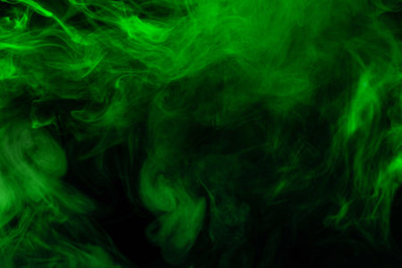 Green steam on a black background. Copy space.の写真素材