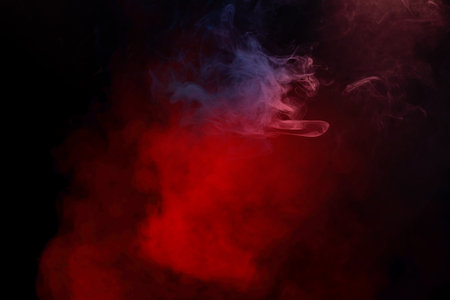 Blue and pink steam on a black background. Copy space.の写真素材